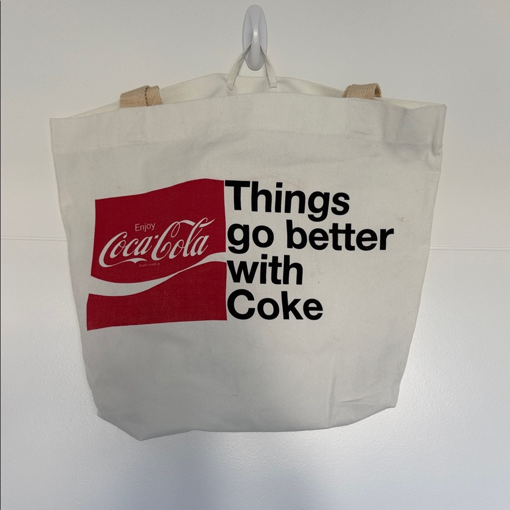 Coca-Cola White Tote with Red Logo and Black Text. 50% Recycled Poly, 50% cotton